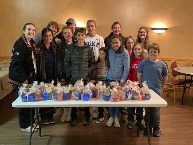 The Tri-Gal 4-H Club is shown with the gift bags for cookie-making we made for the Damascus food pantry.